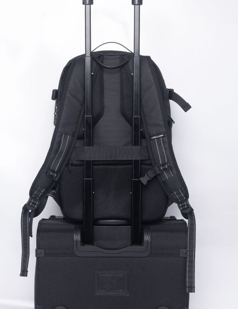 LitePack Pro compression backpack attached to a suitcase handle for easy travel.